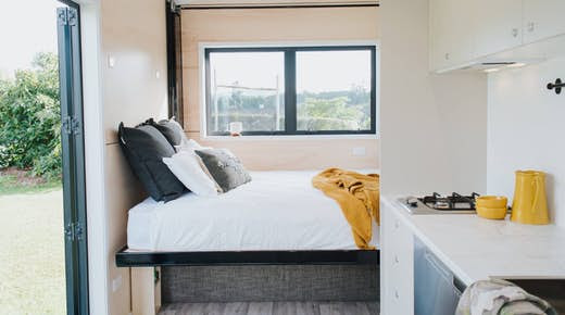 Compact Tiny House Makes Space for Four with Novel Pull-Down Bed