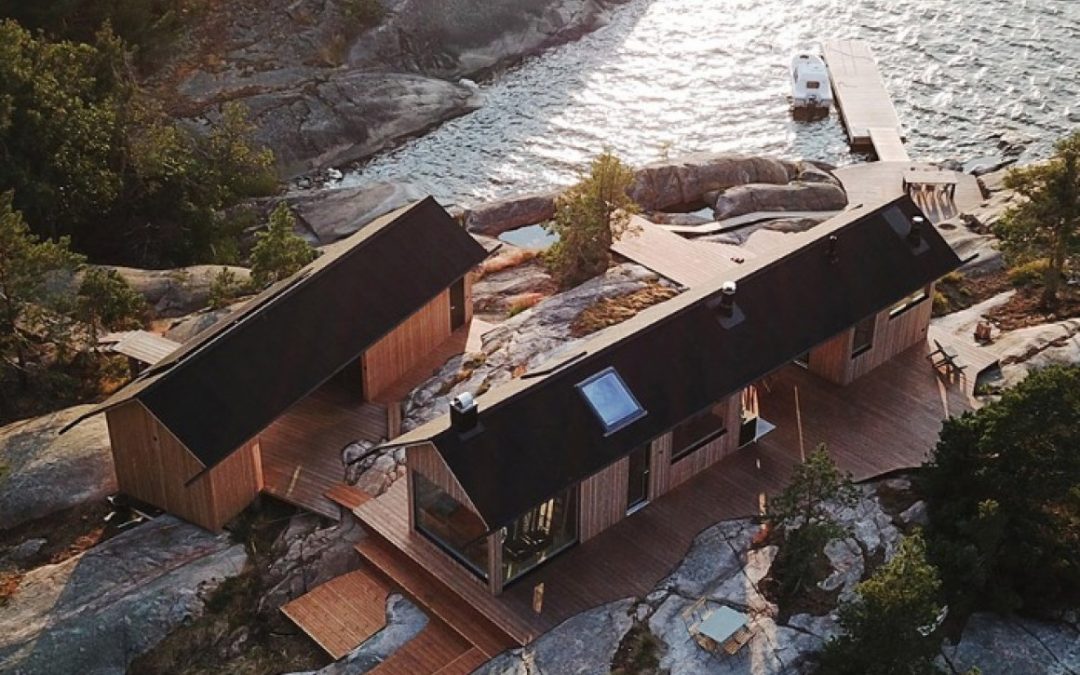 Couple Buy their Own Island and Build Two Stunning off-Grid Cabins