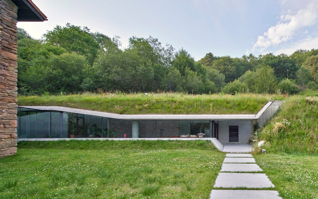Glass Corridor Connects Underground Concrete Extension to House in Spain