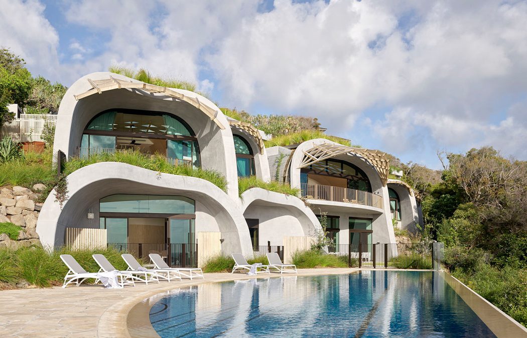 Organic Concrete Curves Give an Unconventional Vibe to This Sustainable Luxury Home