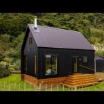 Stunning Black Off-Grid Cabin By The Rive