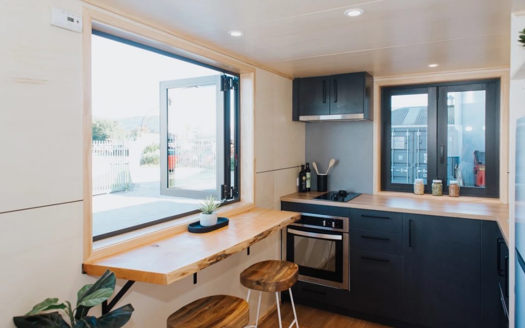 This Compant House Focuses on Storage Space and Large Kitchen Area