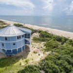 limate-resilient coastal home designed to withstand Category 5 hurricane winds, heavy rainfall, and flooding using reinforced structural connections.
