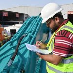 How to Implement an Equipment Preventative Maintenance Plan to Reduce Breakdowns and Downtime Construction and utility equipment undergoing preventive maintenance inspection on an active worksite to reduce breakdowns and improve safety